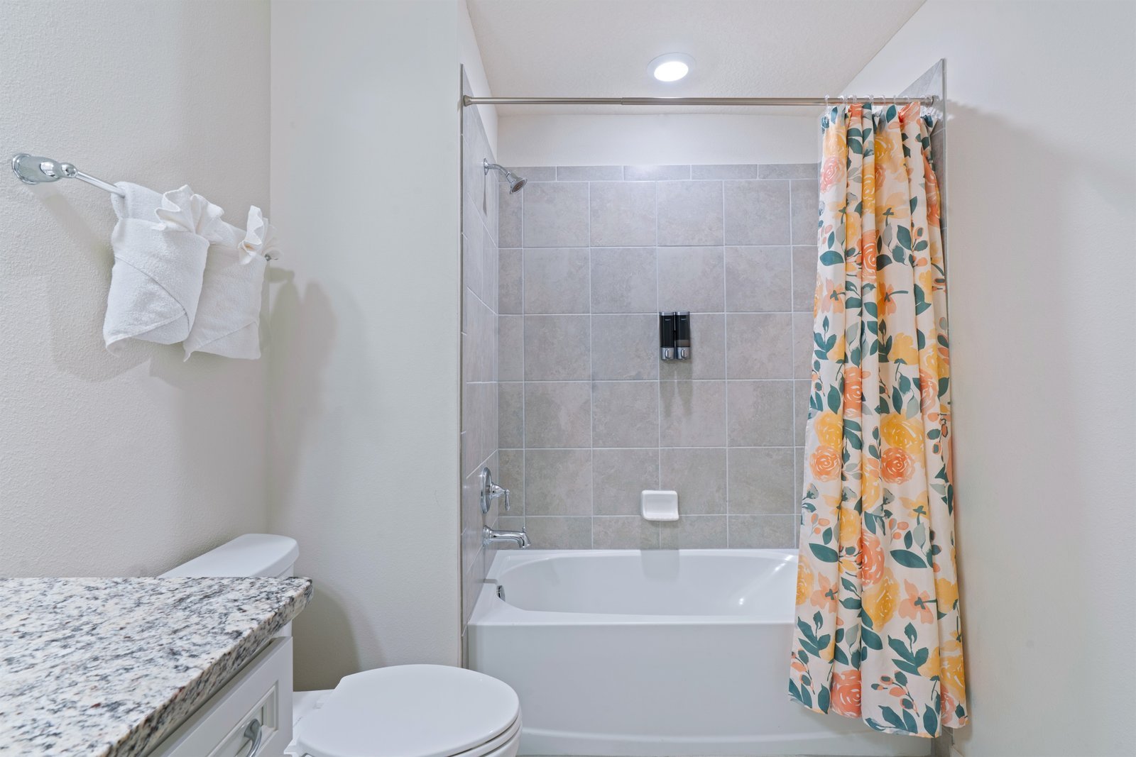 Family bathroom with shower and tub combo, ideal for kids