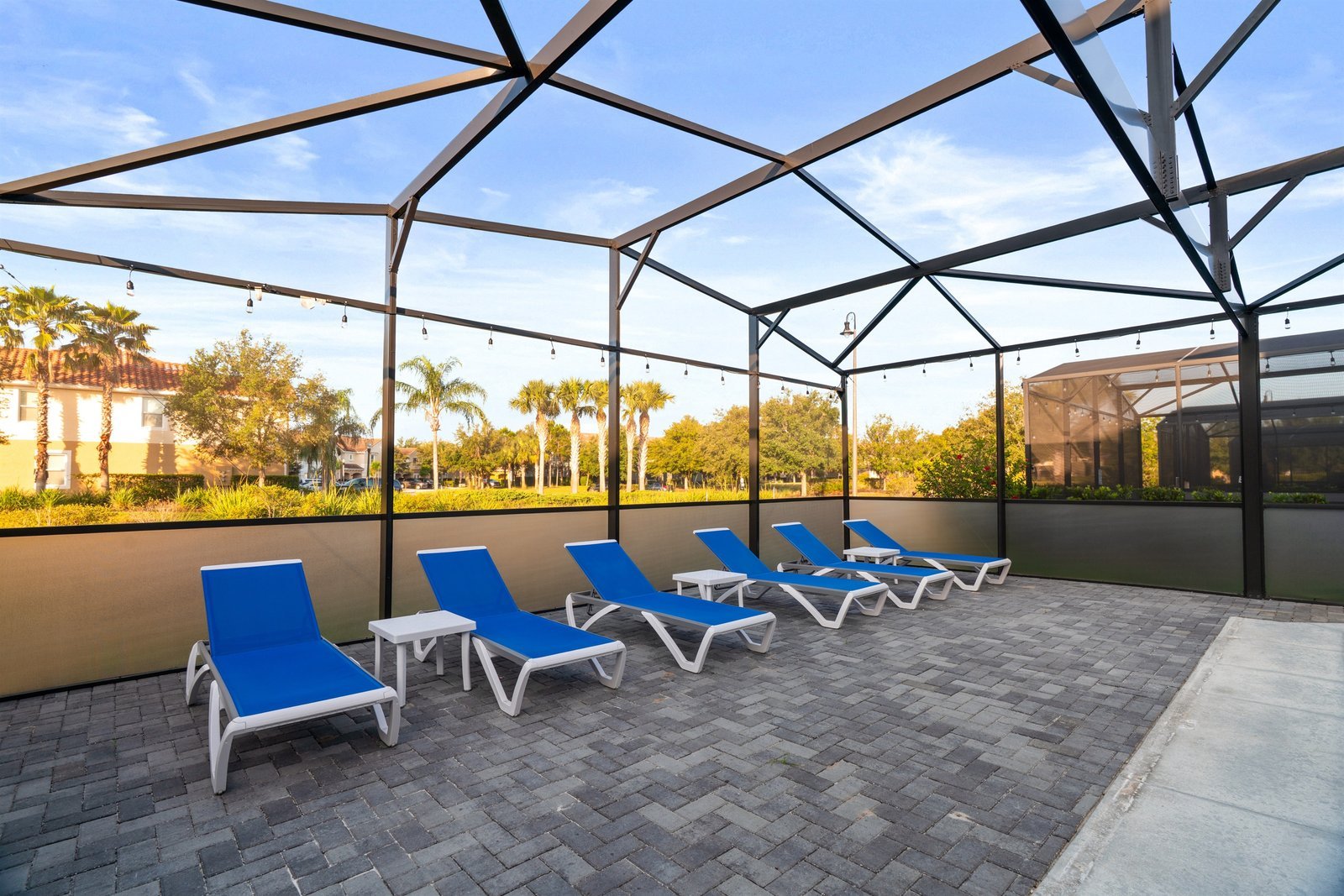 Private pool with basketball hoop, six loungers, and outdoor dining